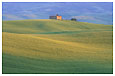 old Tuscan villa and rolling green hills